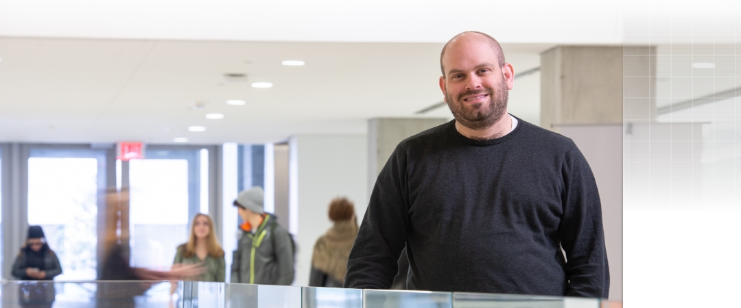 Adam Aviv standing in the science and engineering hall