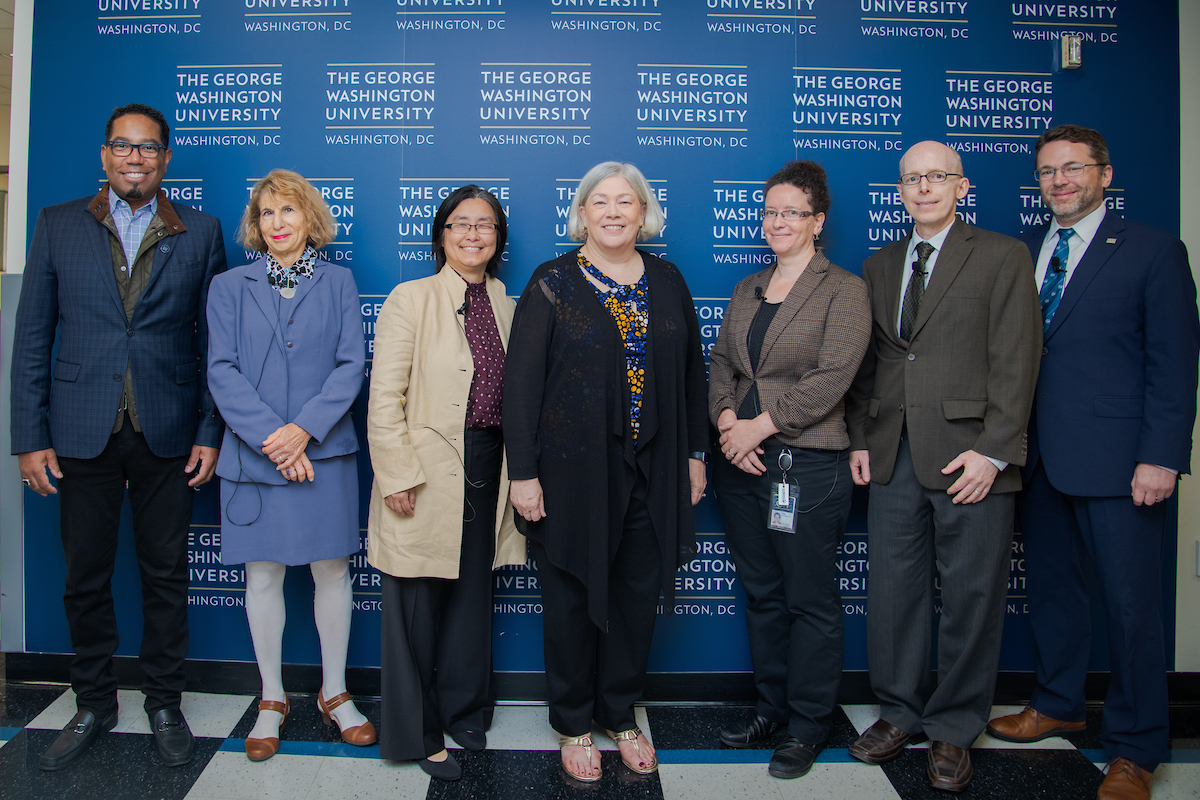 Moderator Dean Lach and panelists Zoe Szajnfarber, Rebecca Hwa, Ryan Watkins, and Susan Aaronson stand with President Ellen Granberg