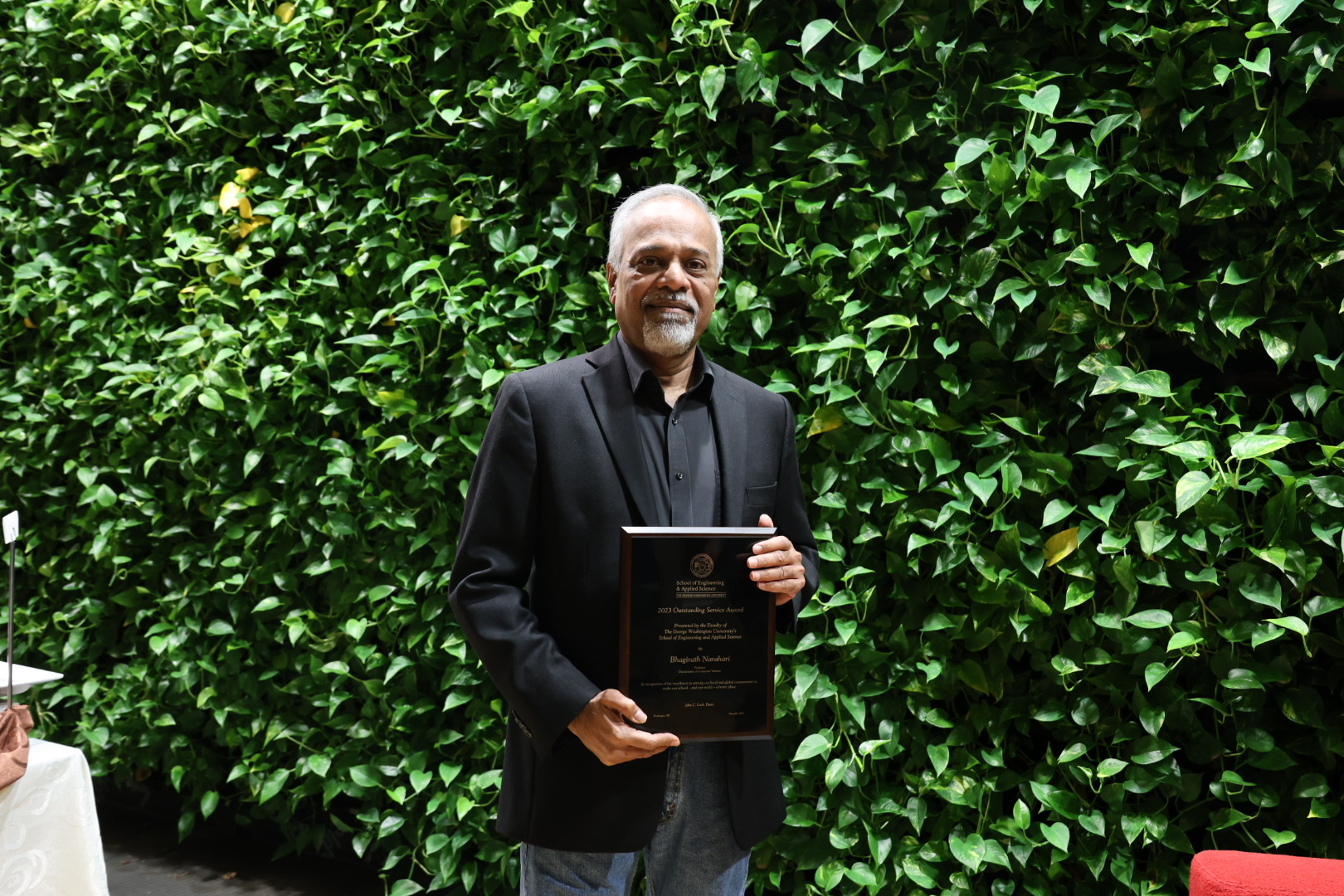 Professor Narahari holding his award plaque