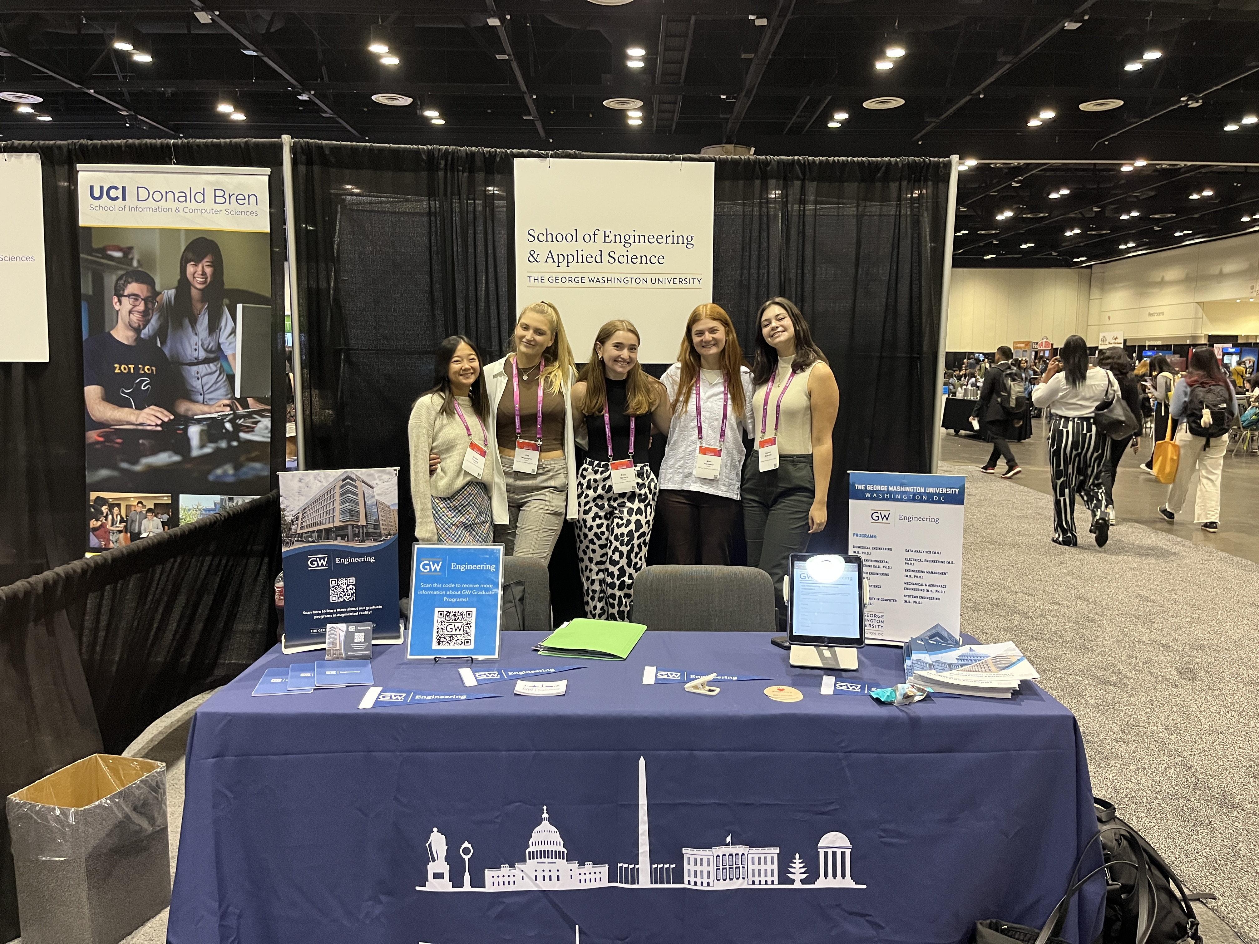Computer Science undergraduate students standing at the GW Engineering table