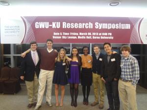 Students in front of a GWU-KU banner
