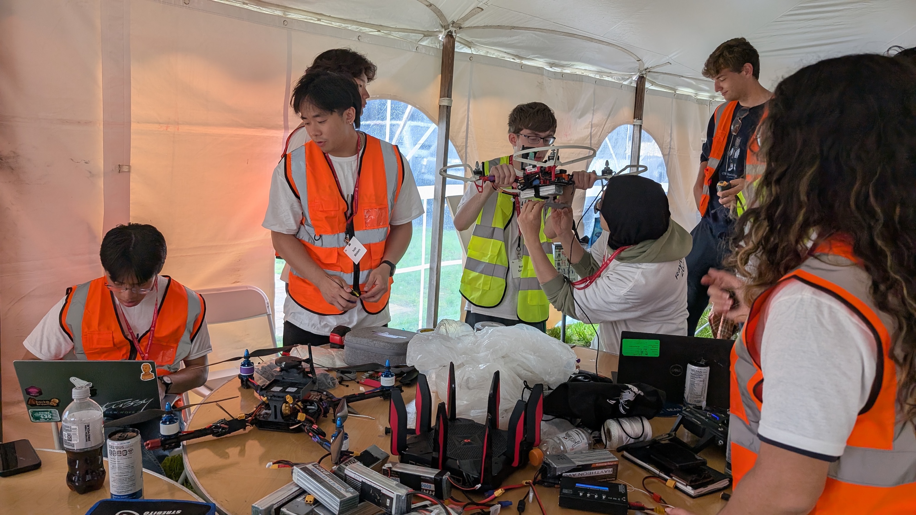 The team working on their drone at the competition The team working on their drone at the competition