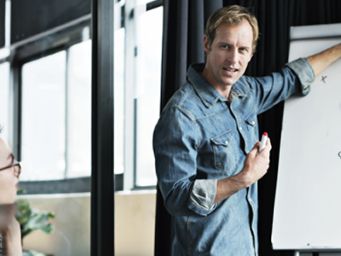 man at whiteboard