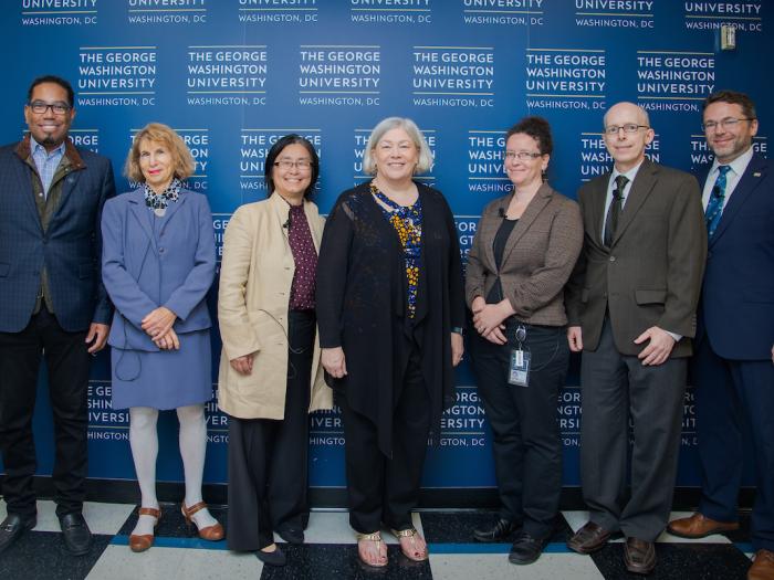 Moderator Dean Lach and panelists Zoe Szajnfarber, Rebecca Hwa, Ryan Watkins, and Susan Aaronson stand with President Ellen Granberg
