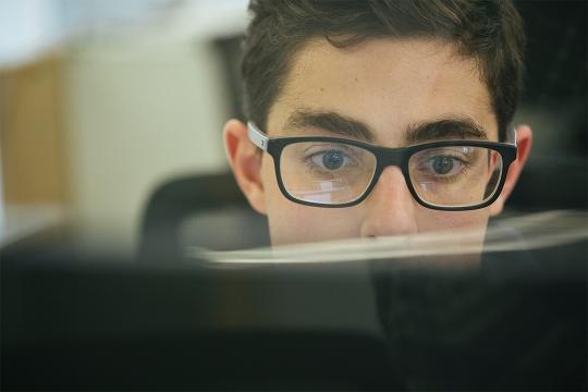 student looking at computer screen
